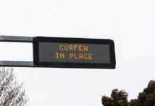 Jersey Shore Meltdown Prompts Curfew Overhead electronic road sign with illuminated message