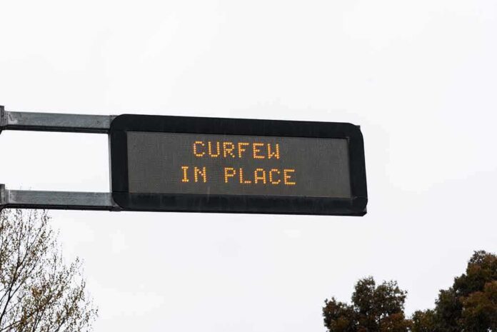 shutterstock_1811055487 Overhead electronic road sign with illuminated message