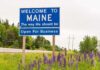 Maine Standoff Risks Capitol Shakeup Welcome to Maine roadside sign with wildflowers