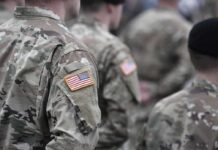 Top States Pamper Vets — Others Punish Soldiers in camouflage uniforms with U.S. flag patches