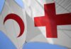 Athens Horror Triggers Red Cross Takedown Red Cross and Red Crescent flags against blue sky