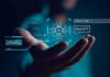 Bots Back Jesus — Perfect Scores Spark Fury Hand holding a glowing AI interface with chat and code elements
