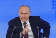Civilians Caught In Dual-Use Crossfire — Winter Risks Soar man in suit speaking at a press conference