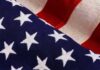 TV Icon Torches America-Bashers – Door’s That Way American flag close-up with stars and stripes