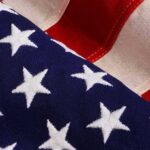 TV Icon Torches America-Bashers – Door’s That Way American flag close-up with stars and stripes