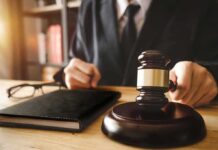 Courtroom Blockade: Iran Tankers On Notice Judge with gavel striking sound block