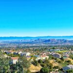 LA Earthquake Swarm – More Than 90! What’s Brewing Underground? Suburban neighborhood with mountains in the distance