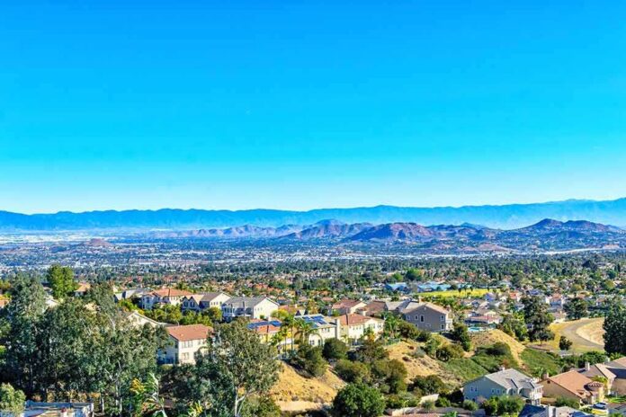 shutterstock_1039231972 Suburban neighborhood with mountains in the distance