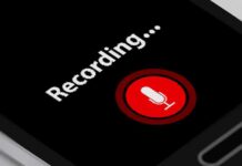 Punish Dissent? Leaked Audio Sparks Democrat Meltdown smartphone screen showing a red microphone recording button