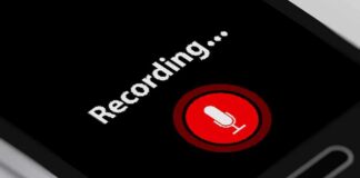 smartphone screen showing a red microphone recording button