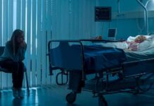 Beloved Headliner Down – MGM Responds hospital room with child in bed and adult sitting nearby