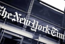 NYT Board Under Fire – What’s Hiding Inside? The New York Times sign on a glass building facade