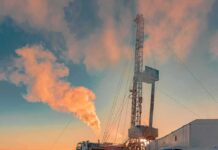 China Oil Crash? Sinopec Sounds Alarm Oil drilling rig at sunset releasing steam