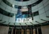 Hamas Link Hidden – Regulator SLAMS BBC BBC headquarters entrance with curved glass facade