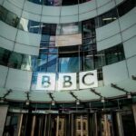 Hamas Link Hidden – Regulator SLAMS BBC BBC headquarters entrance with curved glass facade