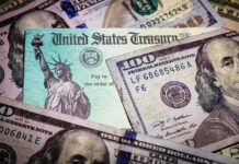 Pandemic Payouts Rigged From Inside United States Treasury check on top of US dollar bills