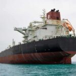 Iran’s Gambit Rattles Global Oil Artery Large oil tanker anchored in calm sea