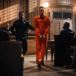 Teen Massacre Confession Shocks Georgia Defendant in orange jumpsuit escorted by officer in courtroom