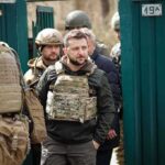 War Twist Brewing: Trump, Zelensky Align? Shaquille Riddick among soldiers in tactical gear near a green gate
