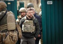 War Twist Brewing: Trump, Zelensky Align? Shaquille Riddick among soldiers in tactical gear near a green gate