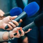 Citizenship For Sale? Abbott Drops Hammer Reporters holding colorful microphones