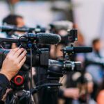 Mother Pleads Guilty, Baby’s Body Still Missing Video cameras on tripods at a media event