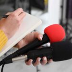 U-Haul WRECKS 12 Cars – LAPD: Driver Was ‘Unaware’ Journalist holding two microphones while writing in a notebook
