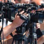Kentucky Showdown: Will Massie Survive Trump? television cameras on tripods at a media event