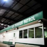 GOP Crowd Roars: Slash Bills, Seal Border Border patrol checkpoint building at night