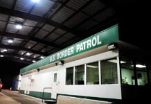 GOP Crowd Roars: Slash Bills, Seal Border Border patrol checkpoint building at night