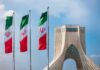 Currency Freefall – Rial Meltdown Sparks Furious Streets Iranian flags beside Azadi Tower in Tehran