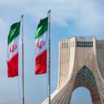 Iranian flags beside Azadi Tower in Tehran