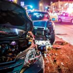 Policy Backfires? Mayor’s Spouse Injured Wrecked cars at night crash scene with police lights