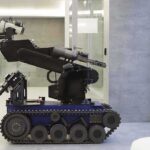 Crime Plunge—or Hype? Atlanta’s Robo Patrol A robotic arm mounted on a tracked base in a modern workspace