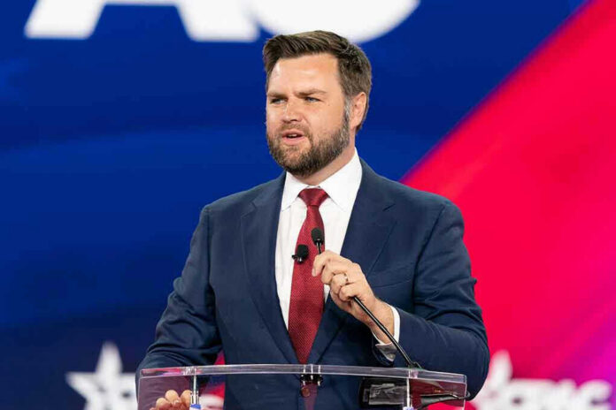 man in suit speaking at a podium