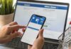 New Mexico HAMMERS Meta – $25 Billion Hands using a smartphone with a social media login screen
