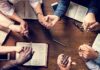 Christian Ministries Muzzled – Unequal Rules Exposed Group holding hands around open books on a wooden table