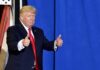 Trump’s Diesel Bombshell Riles Nebraska Donald Trump giving two thumbs up in front of a blue curtain