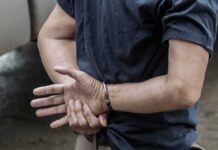 Released, Then Horror: ICE Hold Ignored person in handcuffs with hands behind back