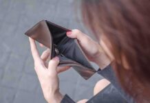 Hands holding an open empty wallet