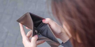 Hands holding an open empty wallet