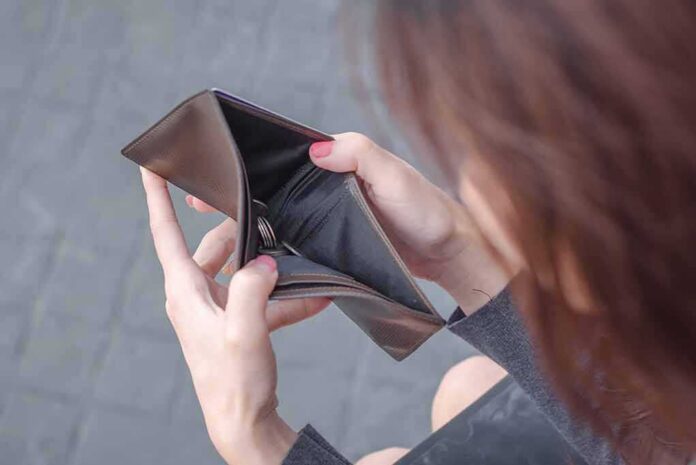 Hands holding an open empty wallet