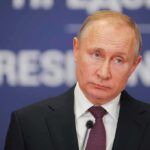 Putin Payday? Republicans Demand a Freeze Vladimir Putin at a podium with microphone