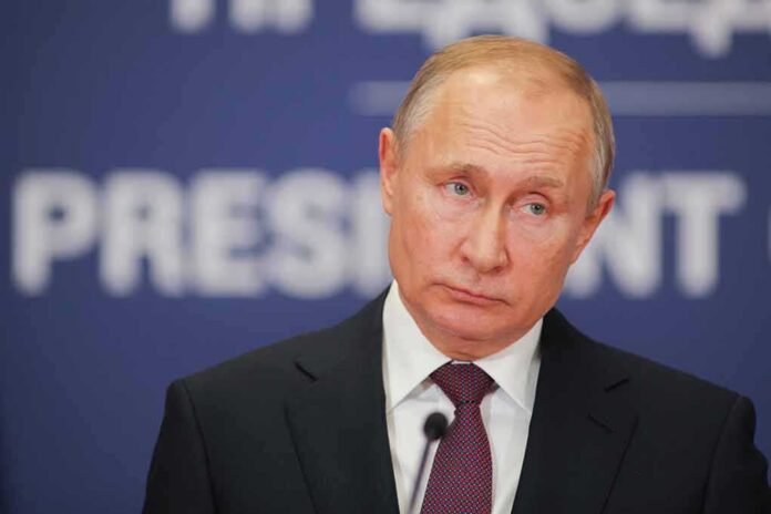 shutterstock_1287905683 Vladimir Putin at a podium with microphone