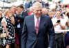 Prince Andrew, Duke of York smiling in a crowd at an outdoor event
