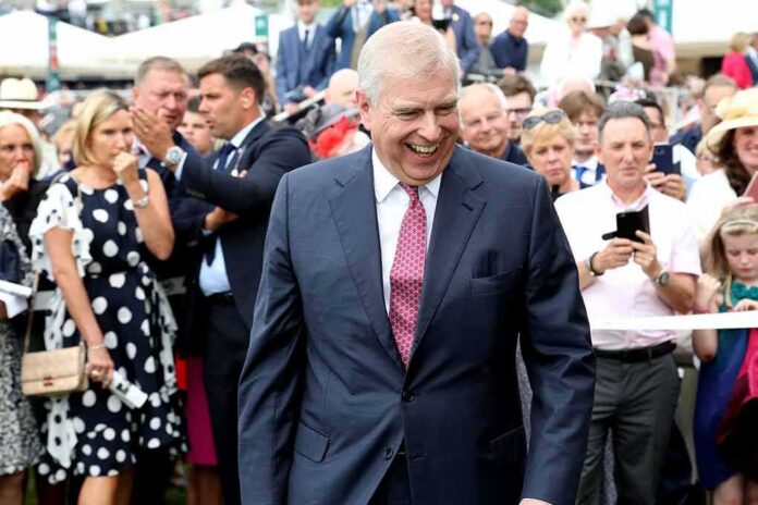shutterstock_1469221997 Prince Andrew, Duke of York smiling in a crowd at an outdoor event