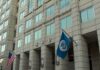 Atlanta ICE Attack Botched – Suspect Vanishes U.S. government building facade with American and blue departmental flags