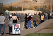 Election Day Squeeze – Democrats Bank Votes voters standing in a long line outside a polling place