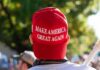 Backlash Explodes – MAGA Picks Up The Tab person wearing a red baseball cap at an outdoor gathering