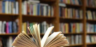 Open book on a table in a library